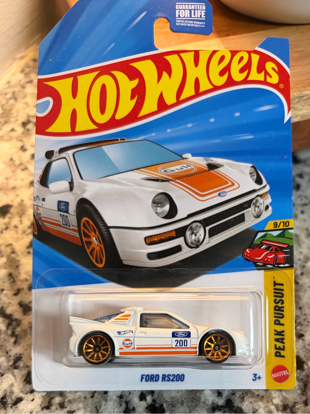 Hot Wheels Ford RS200 Toy Car – White with Orange Accents